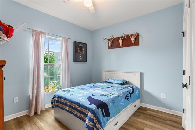 2641 Anchor Dr, Marrero, LA 70072 - bedroom featuring wood finished floors, baseboards, and ceiling fan