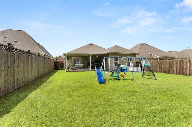 2641 Anchor Dr, Marrero, LA 70072 - rear view of house with a playground