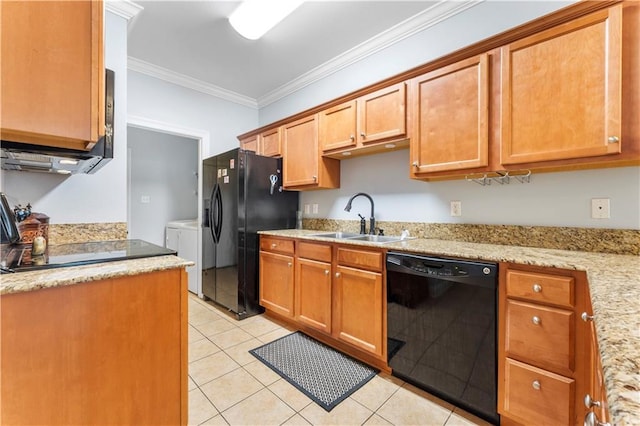 5315 Arlington Ct, Baton Rouge, LA 70820 - kitchen with black appliances, washing machine and dryer, ornamental molding, light tile patterned floors, and light stone counters