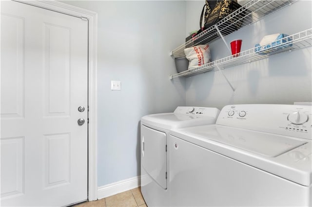 5315 Arlington Ct, Baton Rouge, LA 70820 - laundry area with independent washer and dryer and light tile patterned flooring
