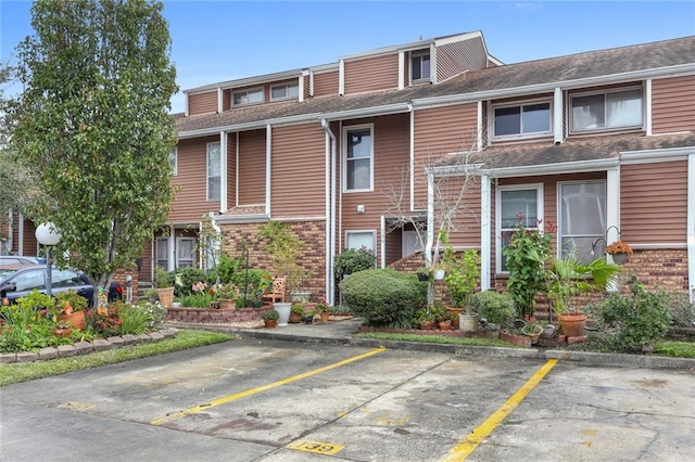 139 Avant Garde Cir Unit 139, Kenner, LA 70065 - view of property featuring uncovered parking