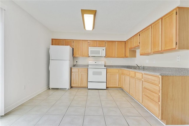 1729 Newport Pl Unit 9, Kenner, LA 70065 - kitchen featuring white appliances, light brown cabinetry, light countertops, light tile patterned floors, and a sink