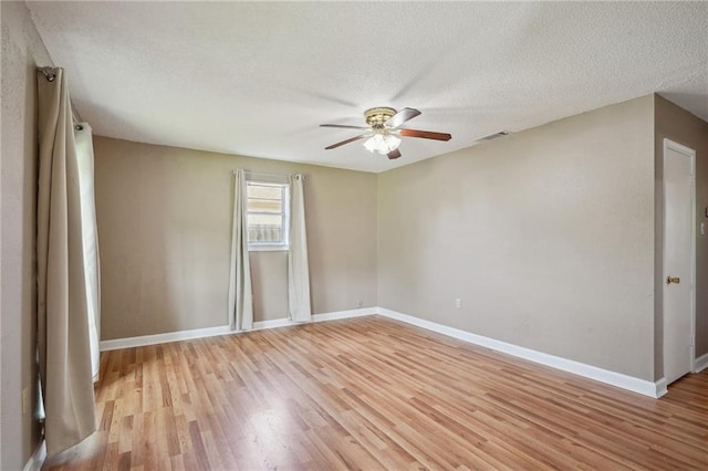 4124 Ames Blvd, Marrero, LA 70072 - unfurnished room featuring a ceiling fan, light wood-type flooring, baseboards, and a textured ceiling