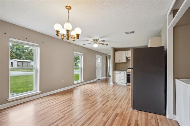 4124 Ames Blvd, Marrero, LA 70072 - kitchen featuring a chandelier, light wood-style flooring, white cabinetry, a textured ceiling, and pendant lighting