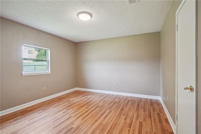 4124 Ames Blvd, Marrero, LA 70072 - spare room with light wood-type flooring, a textured ceiling, and baseboards
