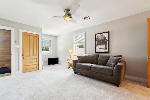 623 Bonnabel Blvd, Metairie, LA 70005 - living area featuring a ceiling fan, light carpet, and baseboards