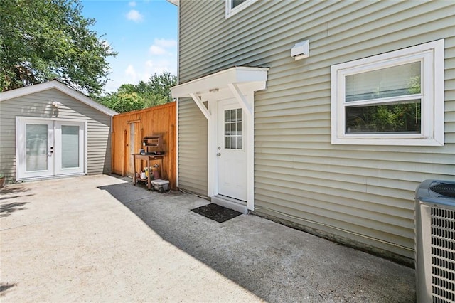 623 Bonnabel Blvd, Metairie, LA 70005 - view of exterior entry featuring central AC unit, a patio area, and french doors