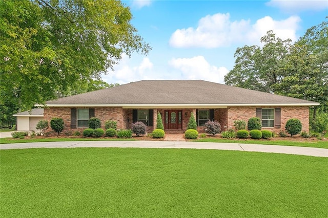 63 Doubloon Dr, Slidell, LA 70461 - ranch-style house featuring a front yard, brick siding, and concrete driveway