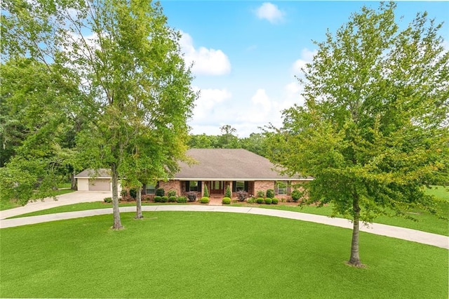63 Doubloon Dr, Slidell, LA 70461 - ranch-style house featuring concrete driveway, a front lawn, and a garage