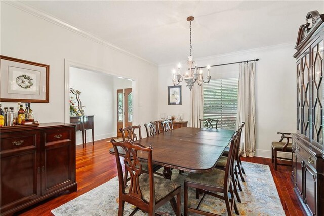 63 Doubloon Dr, Slidell, LA 70461 - dining area with a chandelier, plenty of natural light, ornamental molding, dark wood-style floors, and baseboards