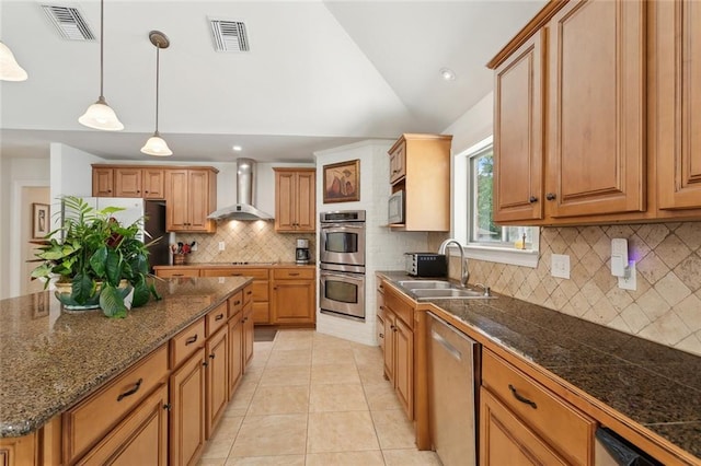 63 Doubloon Dr, Slidell, LA 70461 - kitchen featuring wall chimney range hood, stainless steel appliances, decorative backsplash, a sink, and lofted ceiling