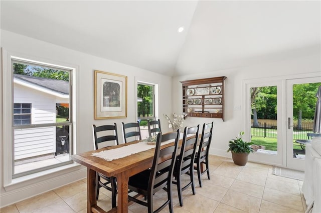 63 Doubloon Dr, Slidell, LA 70461 - dining room with healthy amount of natural light, light tile patterned flooring, baseboards, recessed lighting, and high vaulted ceiling