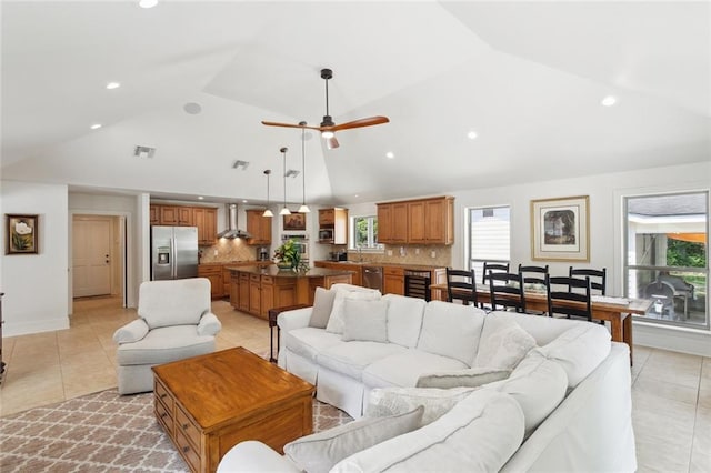 63 Doubloon Dr, Slidell, LA 70461 - living area featuring light tile patterned floors, healthy amount of natural light, recessed lighting, ceiling fan, and beverage cooler