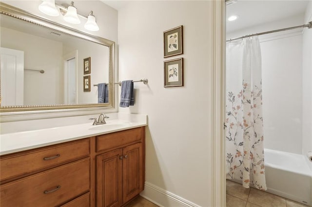 63 Doubloon Dr, Slidell, LA 70461 - full bathroom featuring vanity, tile patterned flooring, shower / bath combo with shower curtain, and baseboards