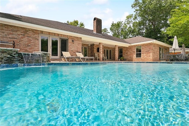 63 Doubloon Dr, Slidell, LA 70461 - community pool with french doors and a patio area