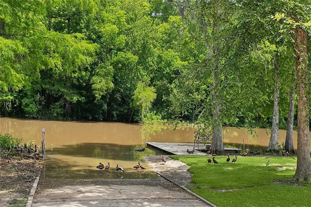 63 Doubloon Dr, Slidell, LA 70461 - view of community with a boat ramp, a boat dock, and a water view