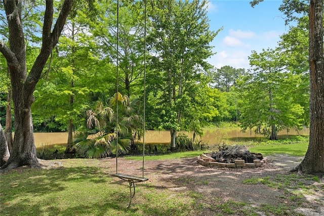 63 Doubloon Dr, Slidell, LA 70461 - view of yard with a fire pit