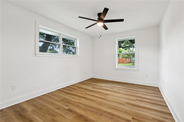 1617 Claudius St, Metairie, LA 70005 - spare room featuring plenty of natural light, light wood-type flooring, and a ceiling fan