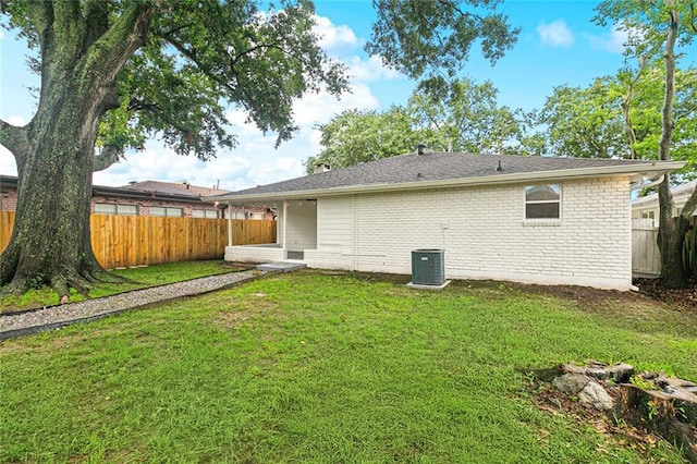1617 Claudius St, Metairie, LA 70005 - back of house featuring central AC and brick siding