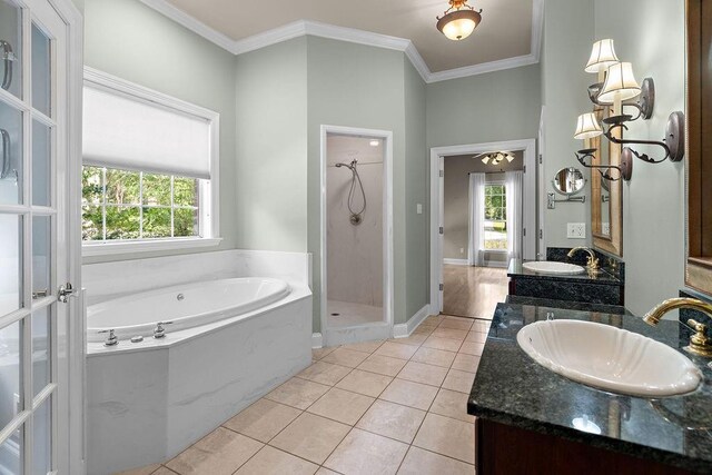 444 Trailhead Dr, Abita Springs, LA 70420 - full bath with a garden tub, double vanity, a shower stall, crown molding, and tile patterned floors