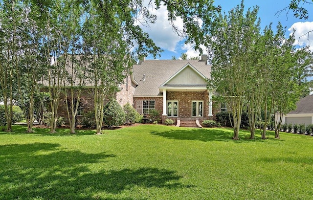 444 Trailhead Dr, Abita Springs, LA 70420 - view of front facade featuring a front yard, brick siding, and a shingled roof