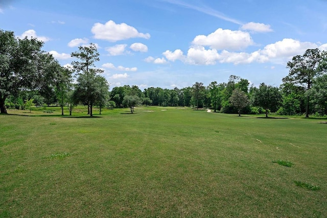 444 Trailhead Dr, Abita Springs, LA 70420 - view of home's community featuring a lawn and view of wooded area