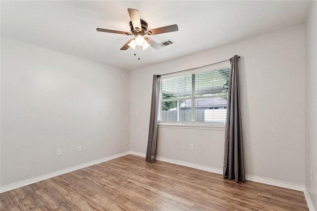 185 Lark St, Slidell, LA 70460 - unfurnished room featuring light wood-style flooring, ceiling fan, and baseboards