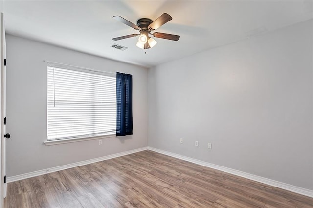 185 Lark St, Slidell, LA 70460 - empty room featuring ceiling fan, wood finished floors, and baseboards