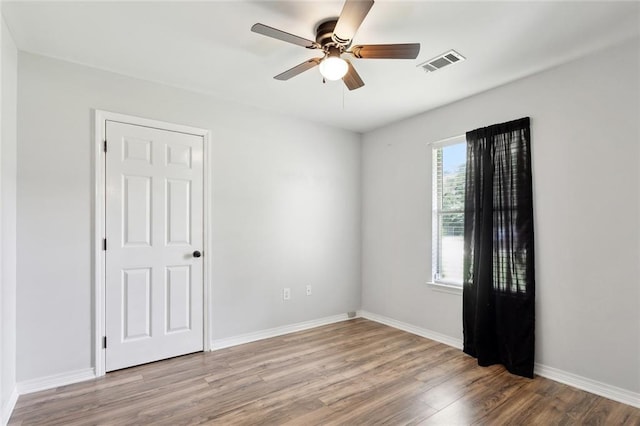 185 Lark St, Slidell, LA 70460 - unfurnished room featuring wood finished floors, ceiling fan, and baseboards