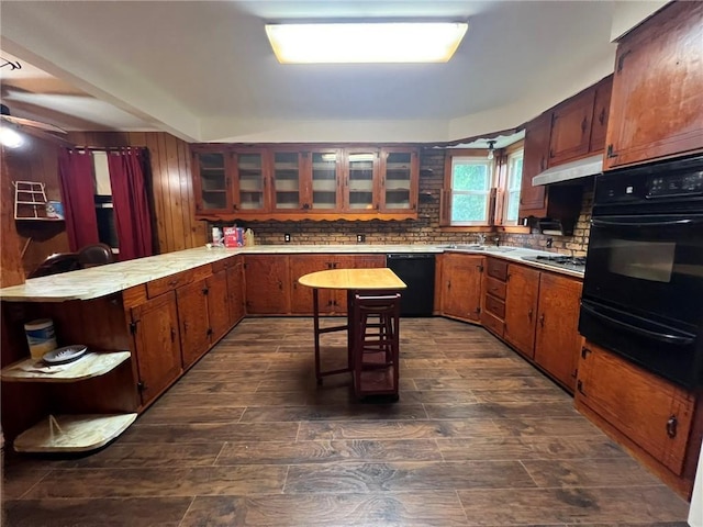 1638 Stafford St, Gretna, LA 70053 - kitchen with black appliances, a warming drawer, a peninsula, open shelves, and light countertops