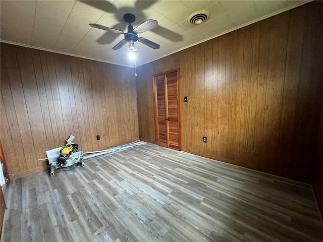 1638 Stafford St, Gretna, LA 70053 - unfurnished room with wood finished floors, a ceiling fan, and wooden walls