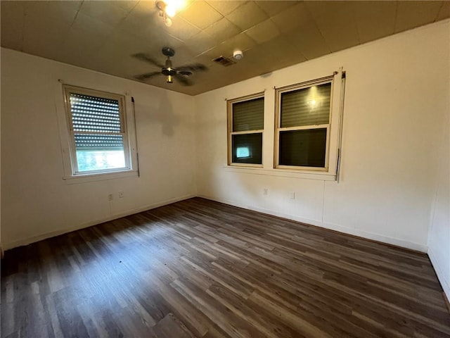 1638 Stafford St, Gretna, LA 70053 - empty room with dark wood-type flooring, ceiling fan, and baseboards
