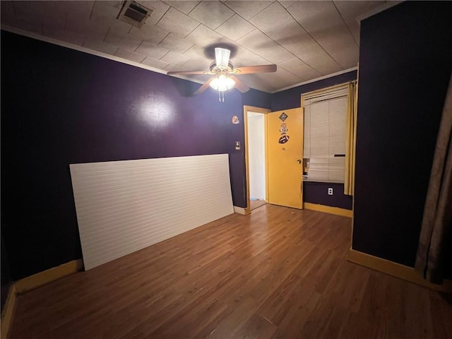 1638 Stafford St, Gretna, LA 70053 - empty room featuring a ceiling fan, wood finished floors, ornamental molding, and baseboards