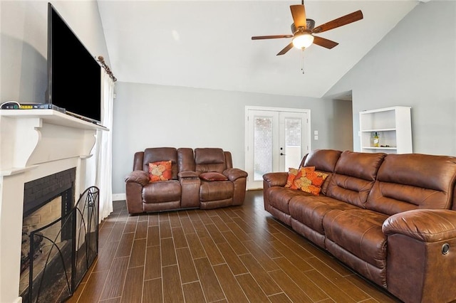 828 3rd Ave, Harvey, LA 70058 - living area featuring high vaulted ceiling, ceiling fan, a fireplace, french doors, and dark wood-style floors