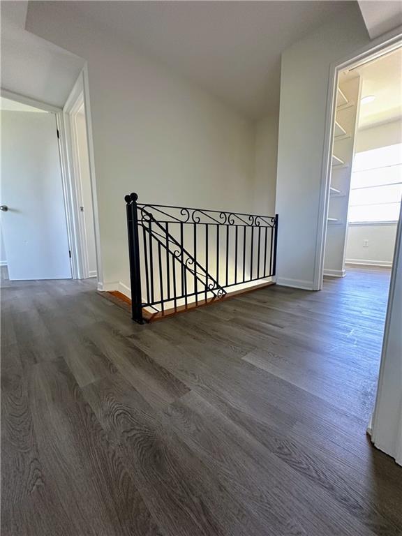 733 Morningside Dr, Gretna, LA 70056 - corridor with an upstairs landing, dark wood-style floors, and baseboards