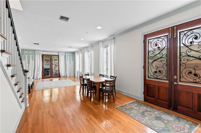 2627 S Carrollton Ave, New Orleans, LA 70118 - dining room featuring french doors, stairway, light wood finished floors, baseboards, and recessed lighting