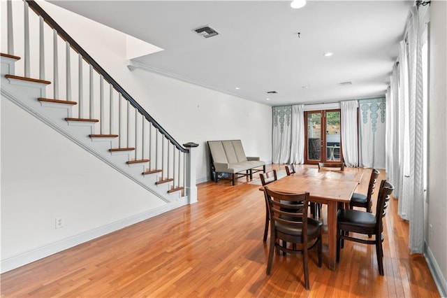 2627 S Carrollton Ave, New Orleans, LA 70118 - dining room featuring wood finished floors, stairway, baseboards, and recessed lighting