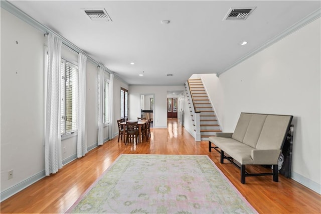 2627 S Carrollton Ave, New Orleans, LA 70118 - living area with stairway, light wood finished floors, baseboards, ornamental molding, and recessed lighting