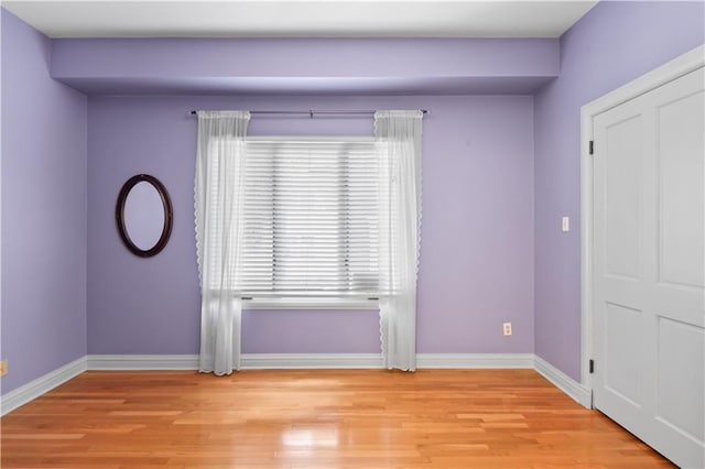 2627 S Carrollton Ave, New Orleans, LA 70118 - empty room featuring light wood finished floors and baseboards