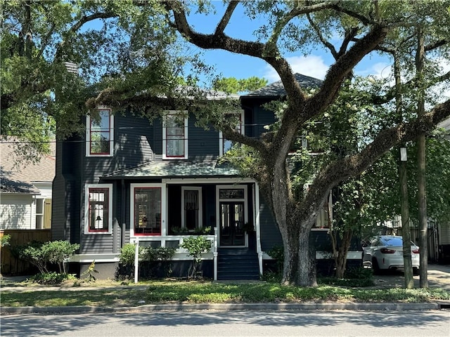826 N Carrollton Ave, New Orleans, LA 70119 - view of front facade featuring covered porch