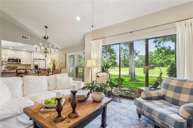 8 S Court Villa Unit 8, Mandeville, LA 70471 - living room featuring lofted ceiling, a chandelier, and wood finished floors