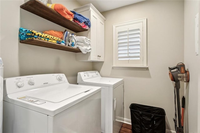 8 S Court Villa Unit 8, Mandeville, LA 70471 - washroom with washer and clothes dryer, cabinet space, and baseboards
