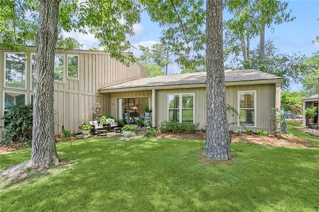 8 S Court Villa Unit 8, Mandeville, LA 70471 - rear view of house with a lawn