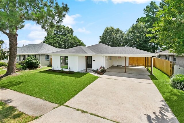 4413 Napoli Dr, Metairie, LA 70002 - view of front of house featuring concrete driveway, an attached carport, and stucco siding