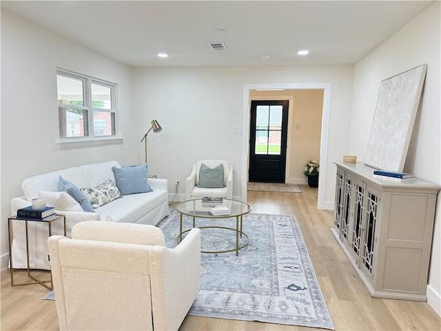 4413 Napoli Dr, Metairie, LA 70002 - living area featuring plenty of natural light, light wood-type flooring, and recessed lighting
