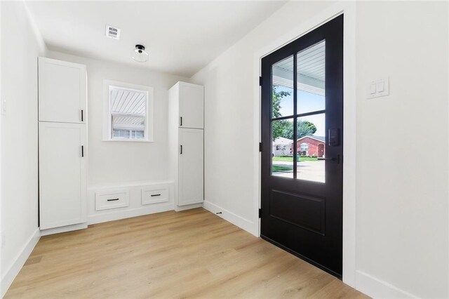 4413 Napoli Dr, Metairie, LA 70002 - foyer entrance with light wood finished floors and baseboards