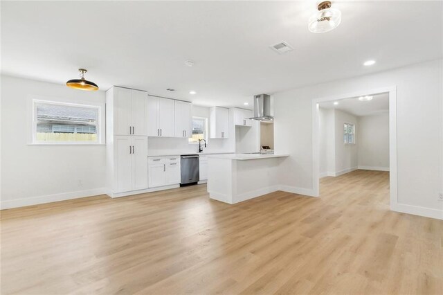 4413 Napoli Dr, Metairie, LA 70002 - unfurnished living room with light wood finished floors and recessed lighting