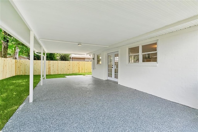 4413 Napoli Dr, Metairie, LA 70002 - fenced backyard with french doors and a patio