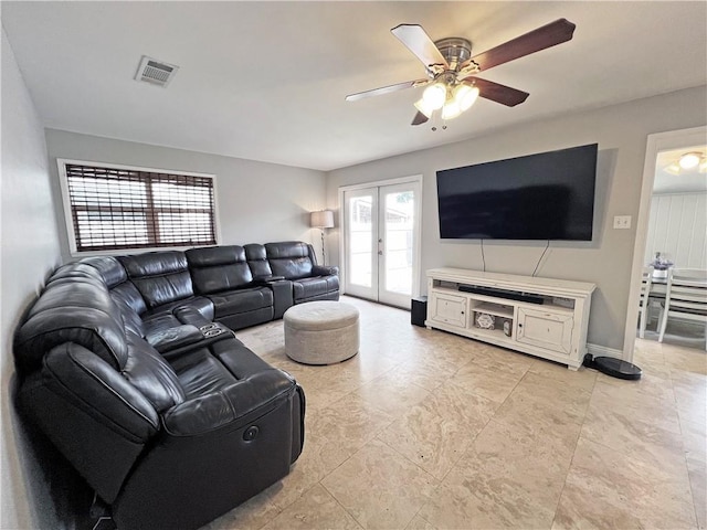 6021 Amhurst St, Metairie, LA 70003 - living area with ceiling fan and french doors