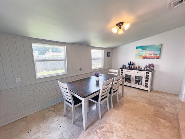 6021 Amhurst St, Metairie, LA 70003 - dining room featuring baseboards and light stone finish flooring